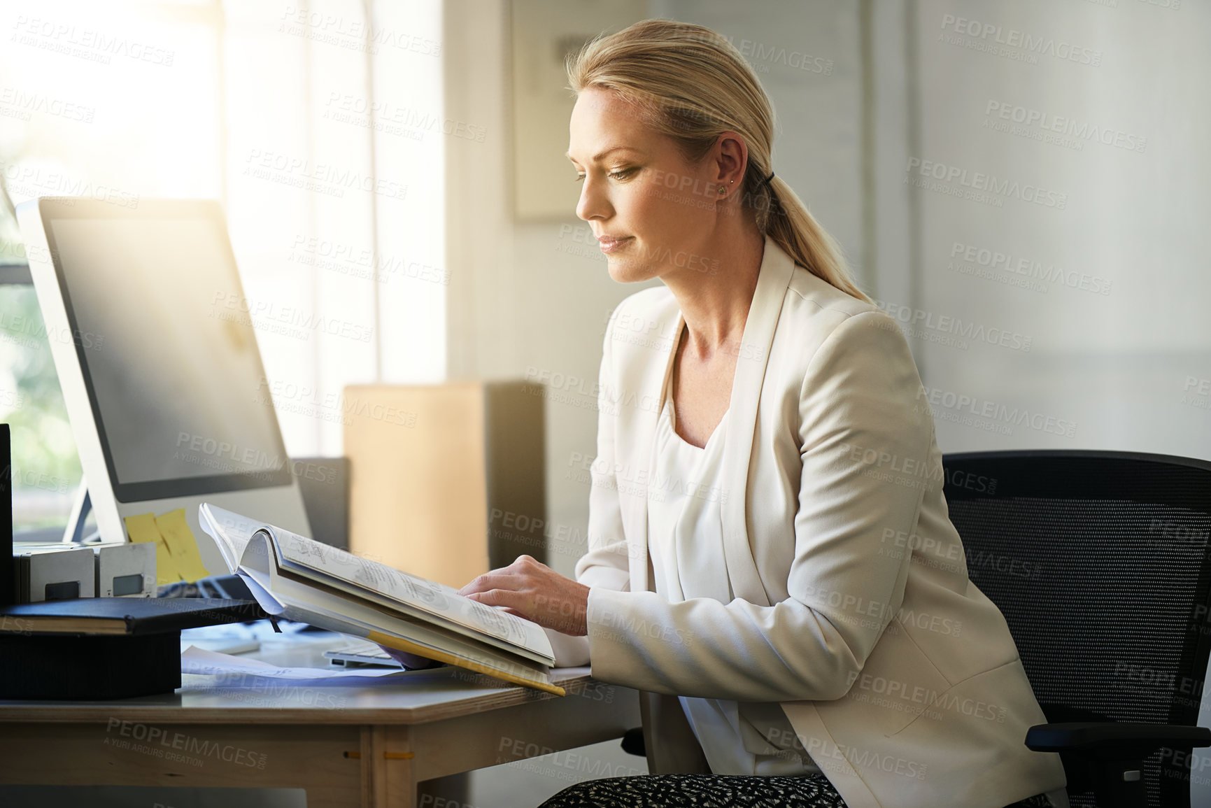 Buy stock photo Research, business women and book in office for ui project, creativity and working at computer. Web designer, agency and employee in workplace for startup, pride and confidence with career documents