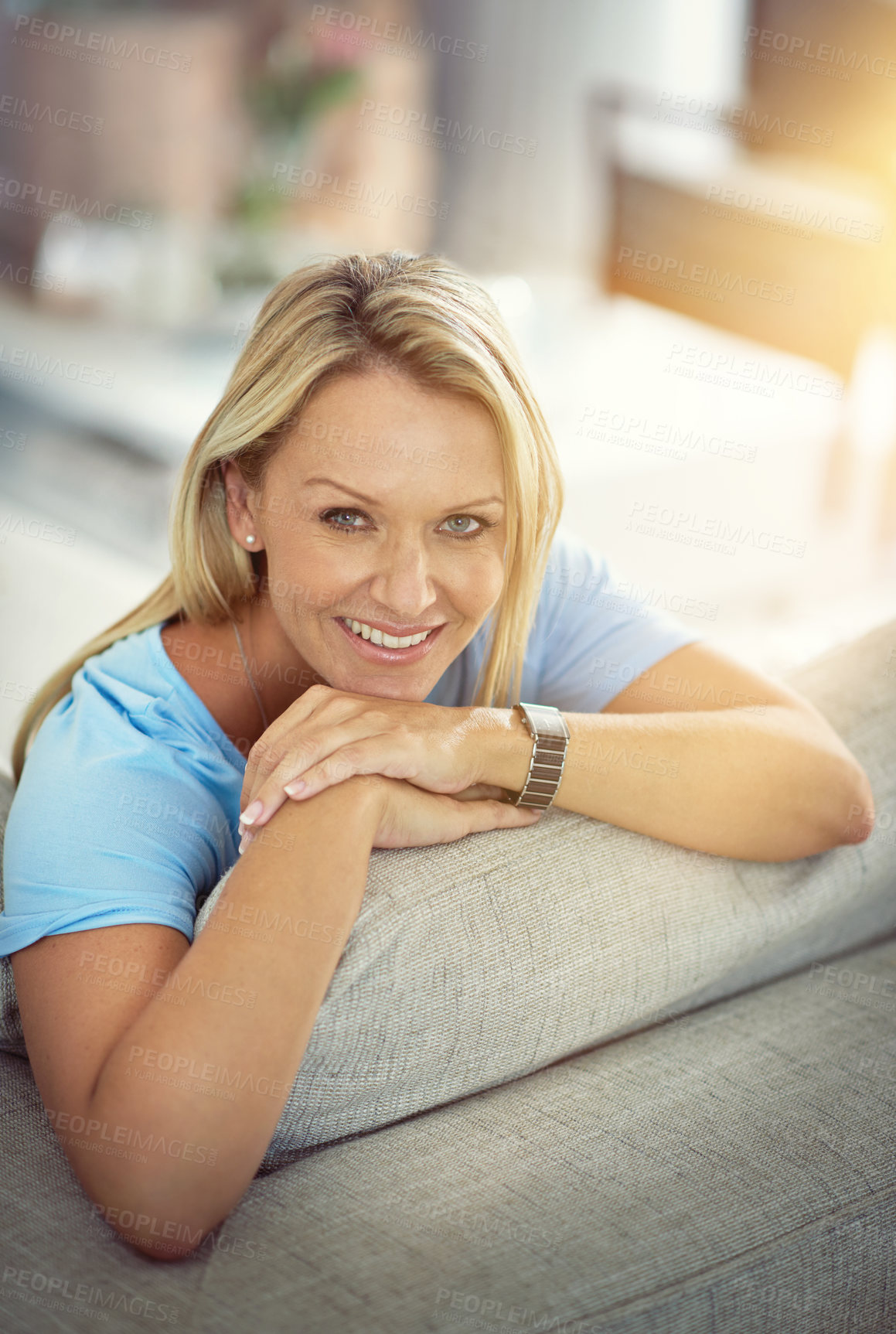 Buy stock photo Portrait of a mature woman relaxing on the sofa at home