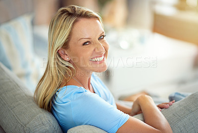 Buy stock photo Portrait of a mature woman relaxing on the sofa at home