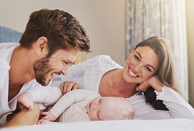 Buy stock photo Portrait of happy mother, father and baby in bedroom for love, care and quality time to relax together in house. Mom, dad and smile with cute infant kid for happiness, support and newborn development