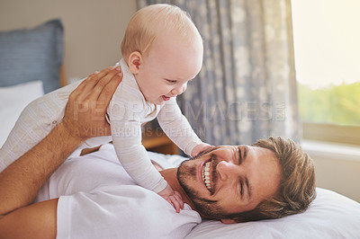 Buy stock photo Father, daughter and holding on bed for laughing, bonding and playing together in bedroom. Happiness, playful man and baby girl for childhood development, parenting and morning fun in apartment