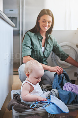 Buy stock photo Laundry, washing and mother with baby in home for multitasking, housekeeping and housework. Family, parenting and mom with newborn in clothing basket for cleaning, hygiene and maintenance on floor