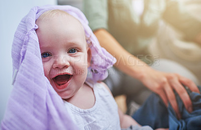 Buy stock photo Laundry, washing and portrait of baby with clothes in home for playing, housekeeping and housework. Family, laughing and parent with happy, excited and playful newborn infant with clothing on floor