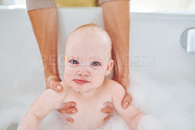 Buy stock photo Soap, bubbles and portrait of baby in bath for cleaning, washing and hygiene with parents in home. Family, bathroom and newborn infant in bathtub, foam and water for wellness, health and childcare