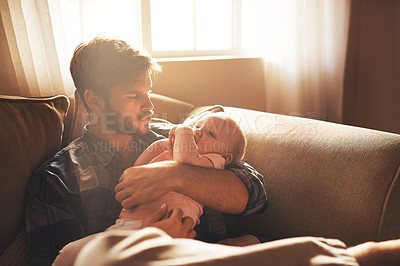 Buy stock photo Family, morning and father with baby on sofa for bonding, relationship and care for parenting. Happy, home and dad with newborn infant for child development, support and affection in living room