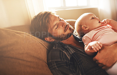 Buy stock photo Tired, morning and father with baby on sofa for bonding, care and relax for parenting. Family, home and dad with newborn infant for child development, sleeping and affection in living room together