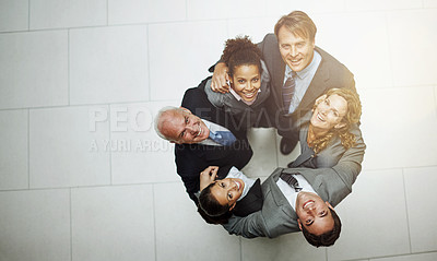 Buy stock photo High angle portrait of a group of businesspeople standing in a huddle