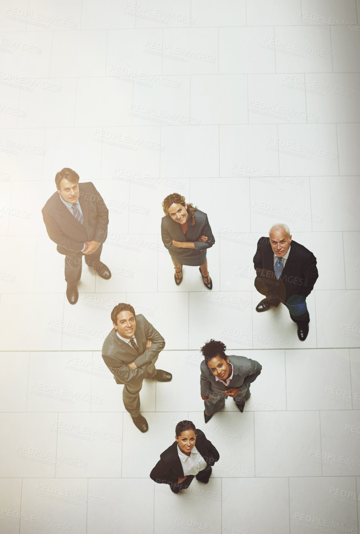 Buy stock photo High angle portrait of a group of businesspeople standing in the office lobby