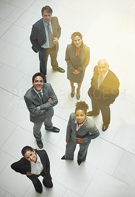 Buy stock photo High angle portrait of a group of businesspeople standing in the office lobby
