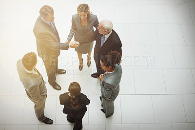 Buy stock photo High angle shot of two groups of business teams meeting for the first time