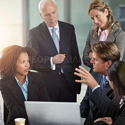 Buy stock photo Cropped shot of a group of businesspeople in a meeting