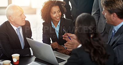 Buy stock photo Cropped shot of a group of businesspeople in a meeting