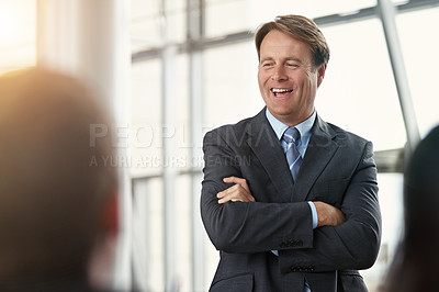 Buy stock photo Cropped shot of businessman addressing his colleagues during a meeting