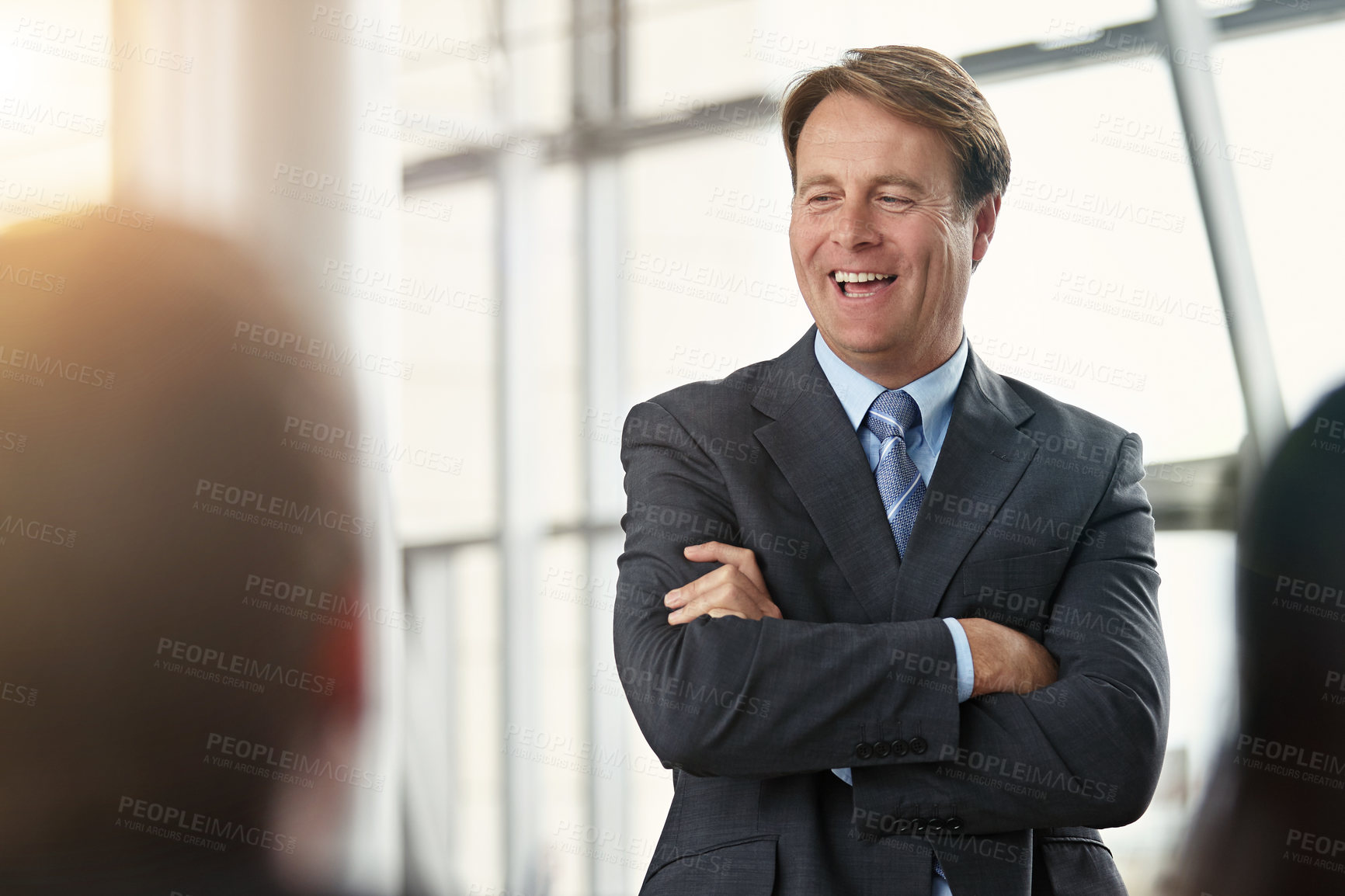 Buy stock photo Cropped shot of businessman addressing his colleagues during a meeting