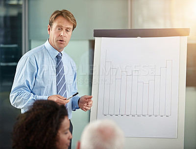 Buy stock photo Cropped shot of businessman addressing his colleagues during a meeting