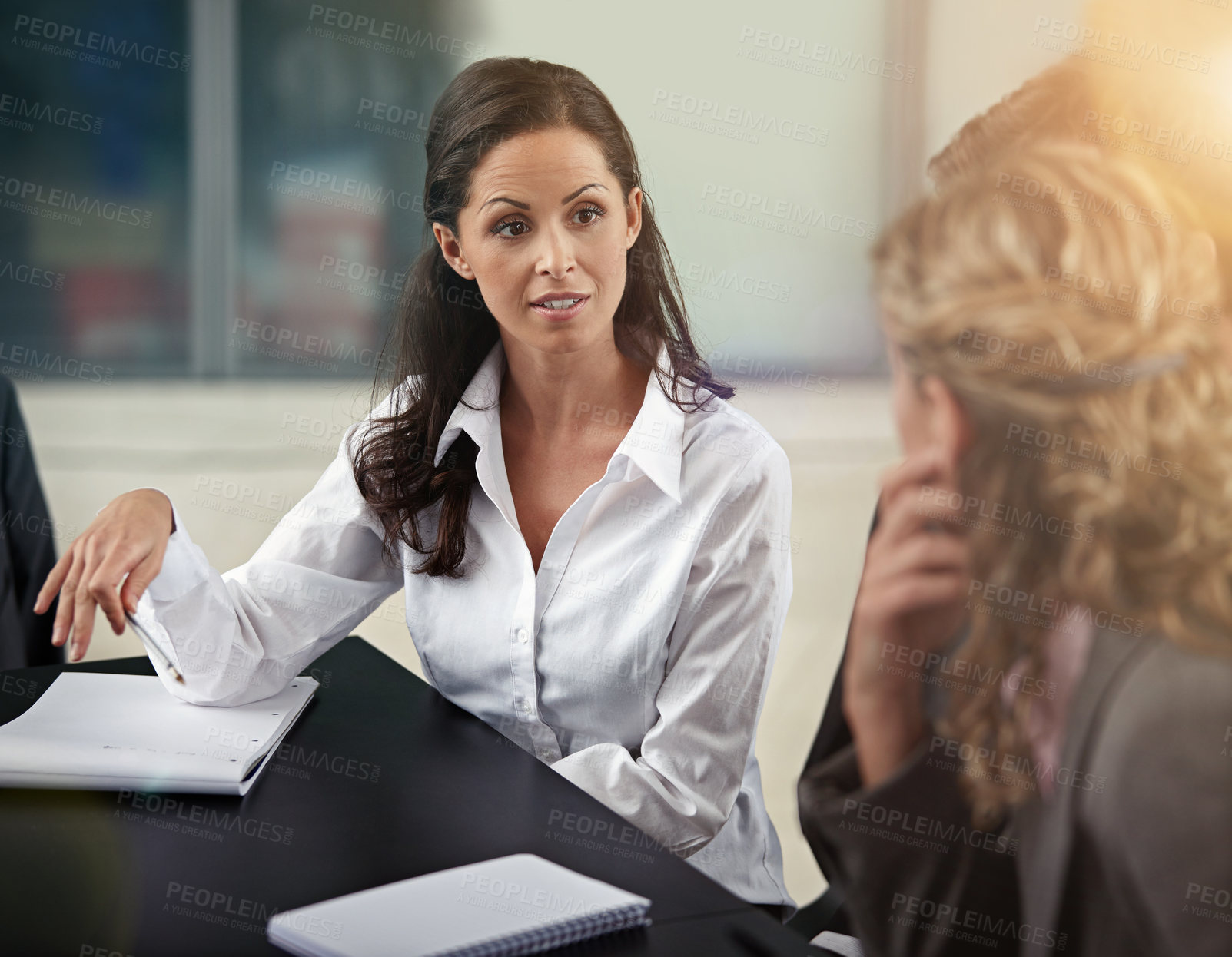 Buy stock photo Cropped shot of a group of businesspeople in a meeting