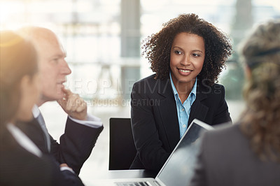 Buy stock photo Cropped shot of a group of businesspeople in a meeting