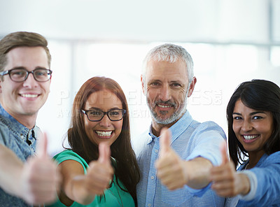 Buy stock photo Cropped portrait of a group of businesspeople giving the thumbs up