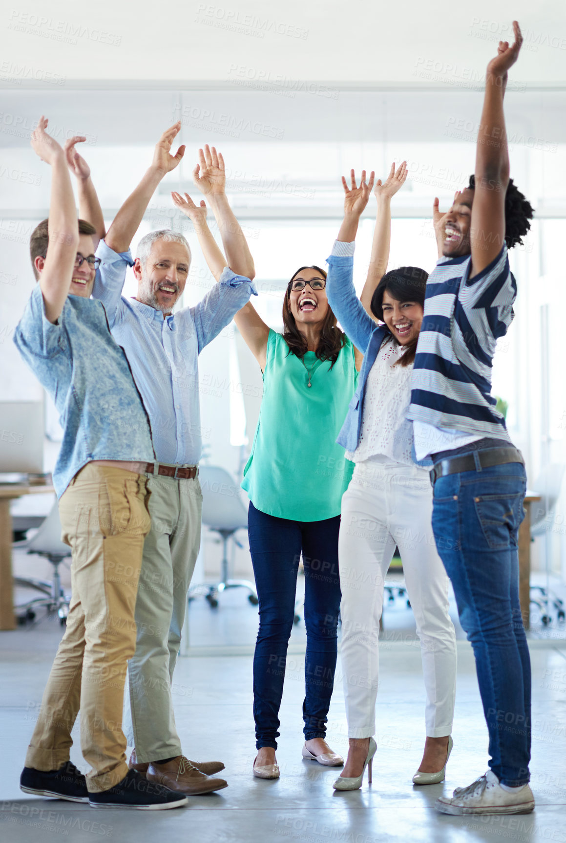 Buy stock photo Cropped shot of a group of businesspeople cheering in an office