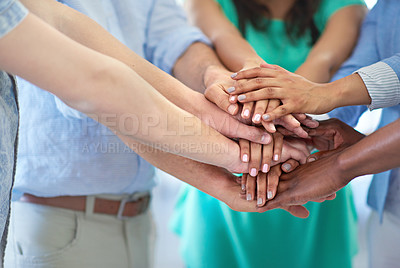 Buy stock photo Cropped shot of a creative business team in a huddle