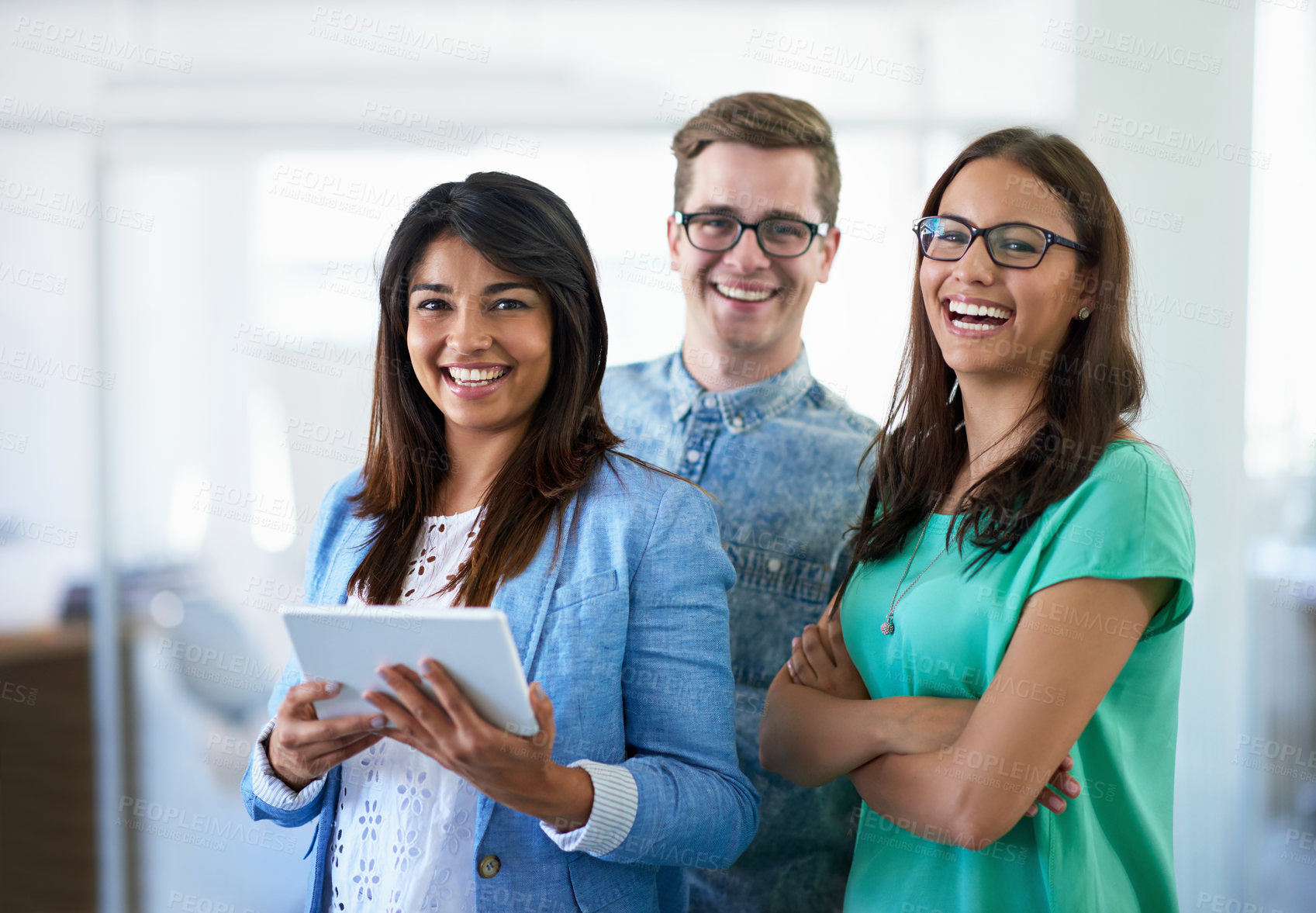 Buy stock photo Cropped portrait of three coworkers standing in the office