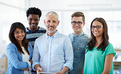 Buy stock photo Cropped portrait of a group of creative businesspeople in the office