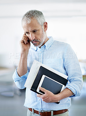 Buy stock photo Cropped shot of a mature businessman talking on his cellphone