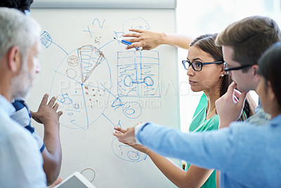 Buy stock photo Cropped shot of a mature businessman meeting with his creative team