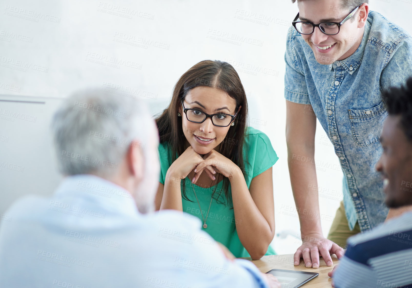 Buy stock photo Cropped shot of a mature businessman meeting with his creative team