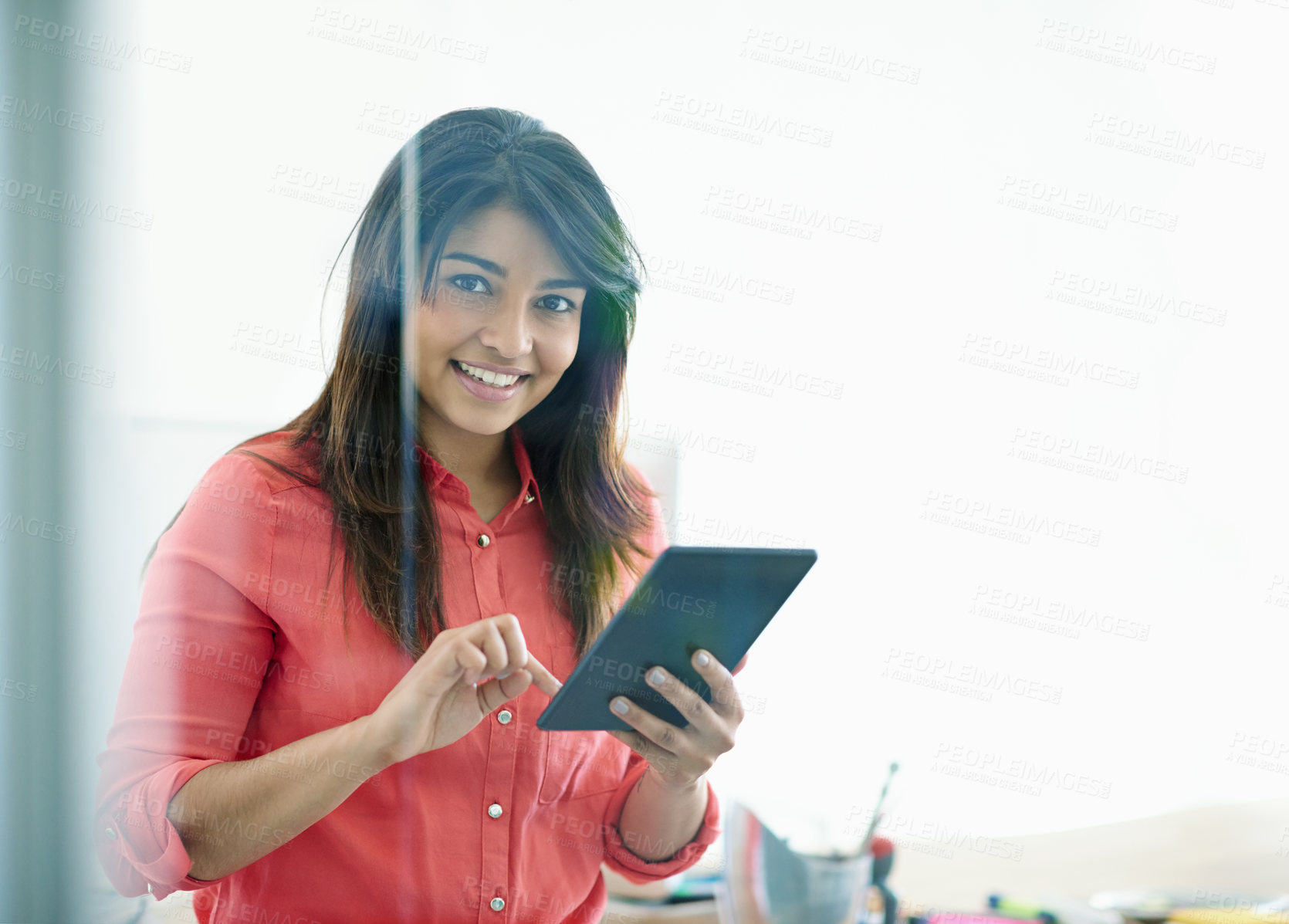 Buy stock photo Cropped shot of a young creative professional using a digital tablet