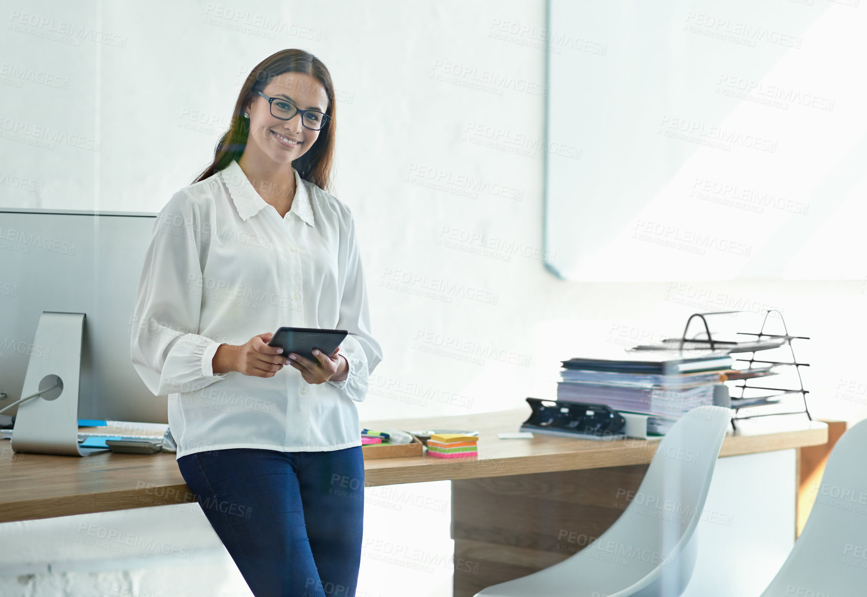 Buy stock photo Portrait of a female designer using a digital tablet in the office