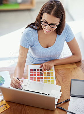 Buy stock photo Cropped shot of a female designer working on a creative project at her desk