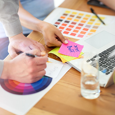 Buy stock photo Shot of two unrecognizable designers working with color swatches in their office