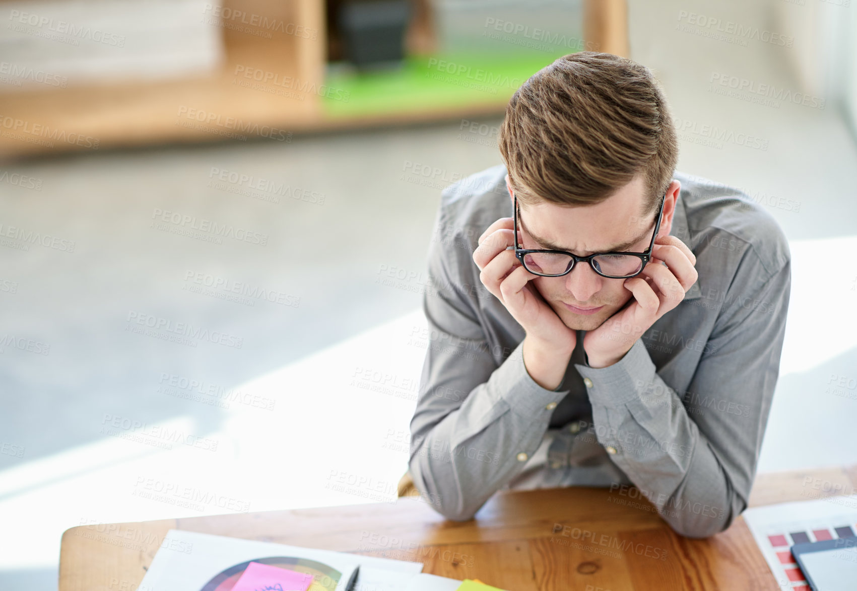 Buy stock photo Shot of a male designer struggling to come up with ideas