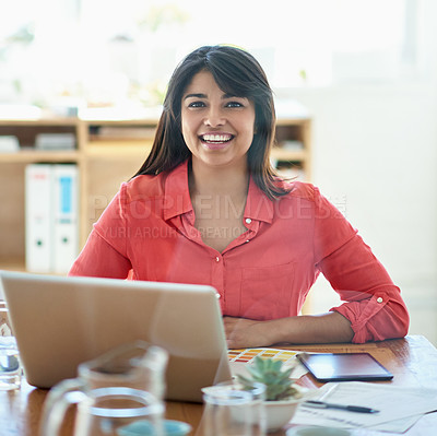 Buy stock photo Cropped portrait of a female designer working on a creative project at her desk