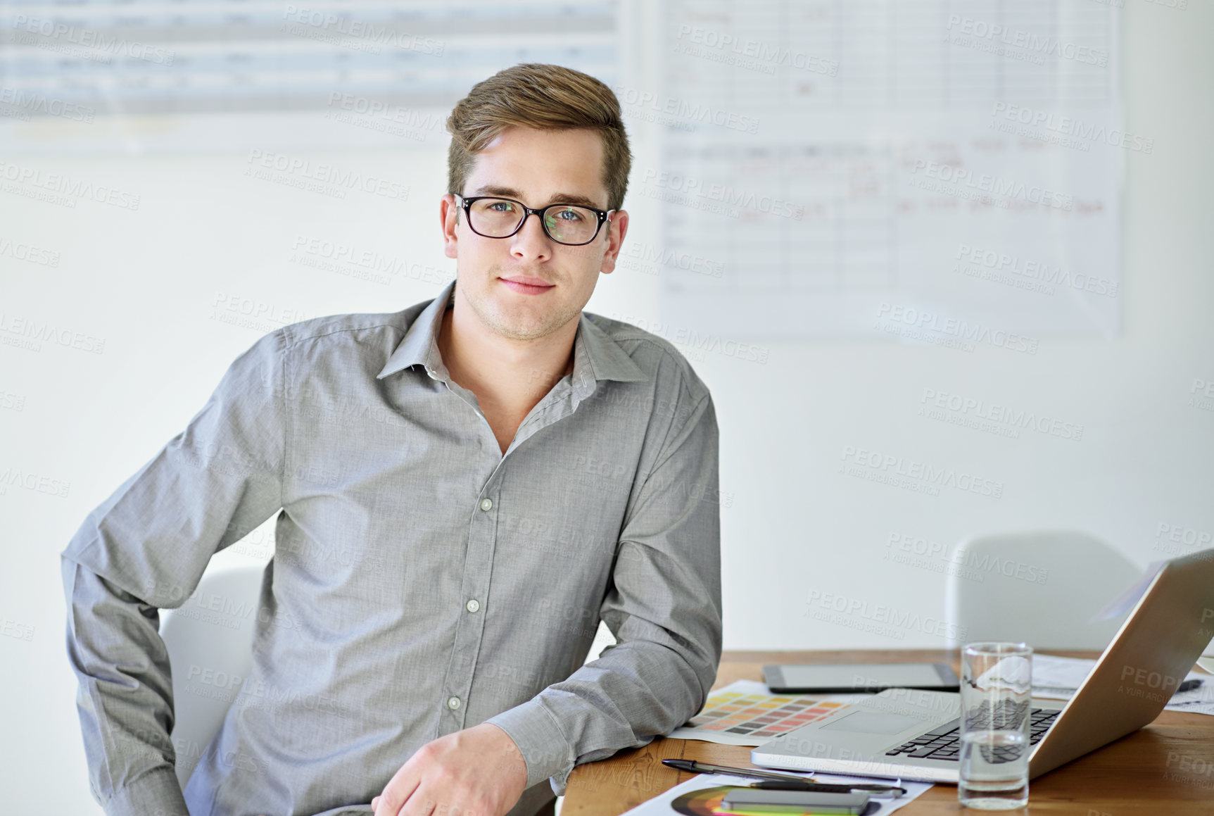 Buy stock photo Portrait of a male designer sitting at his office desk