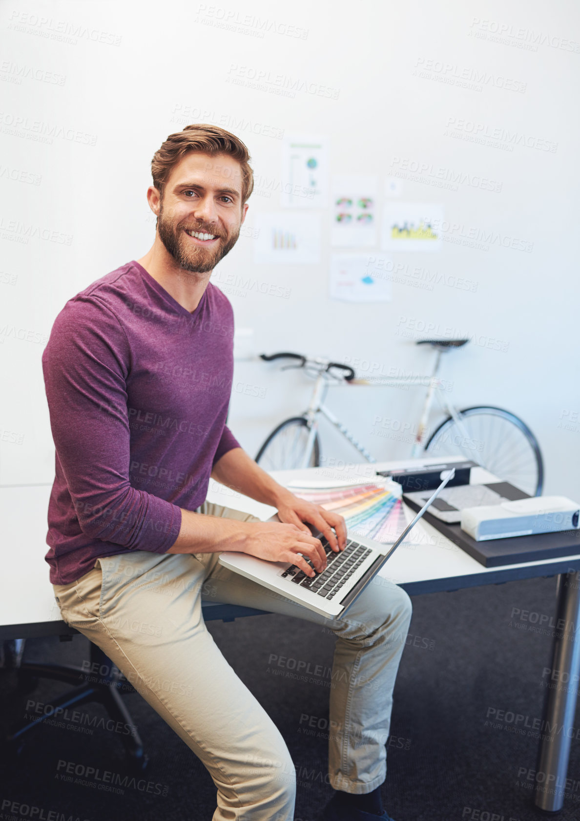 Buy stock photo Cropped portrait of a young architect working on his latop