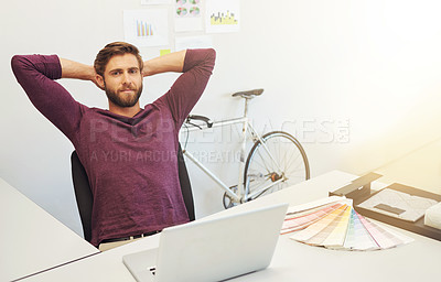 Buy stock photo Cropped portrait of a young architect sitting with his hands behind his head