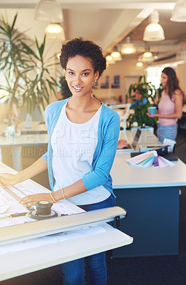Buy stock photo Cropped portrait of a young architect working on her drafting table