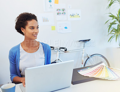 Buy stock photo Cropped shot of a young architect working on her laptop