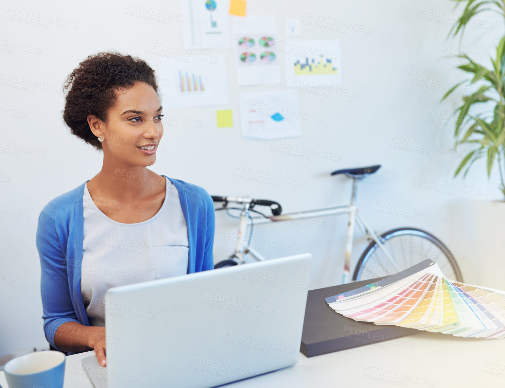 Buy stock photo Cropped shot of a young architect working on her laptop