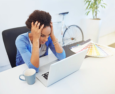 Buy stock photo Cropped shot of a frustrated young architect working on her laptop