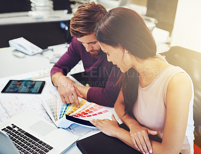 Buy stock photo Cropped shot of two young designers looking at a color swatch