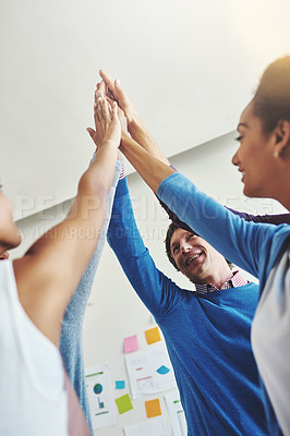 Buy stock photo Shot of a group of businesspeople giving each other a high five