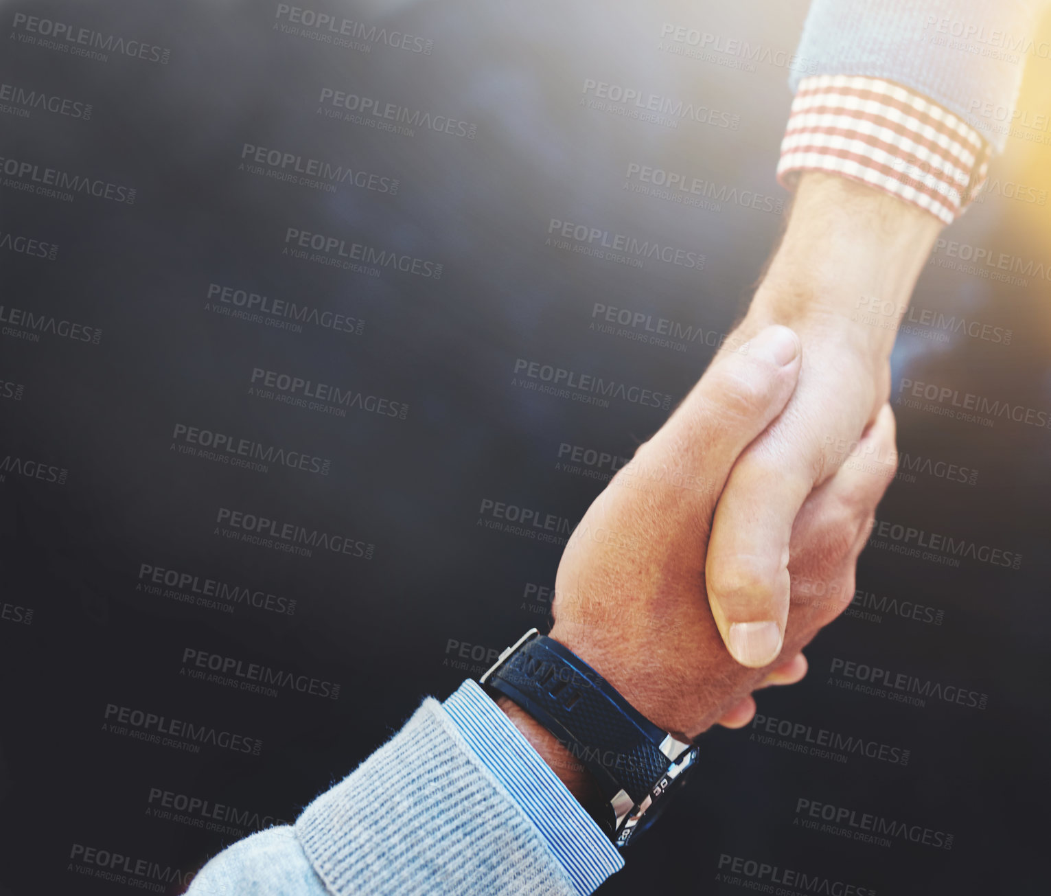 Buy stock photo Closeup shot of two businesspeople shaking hands