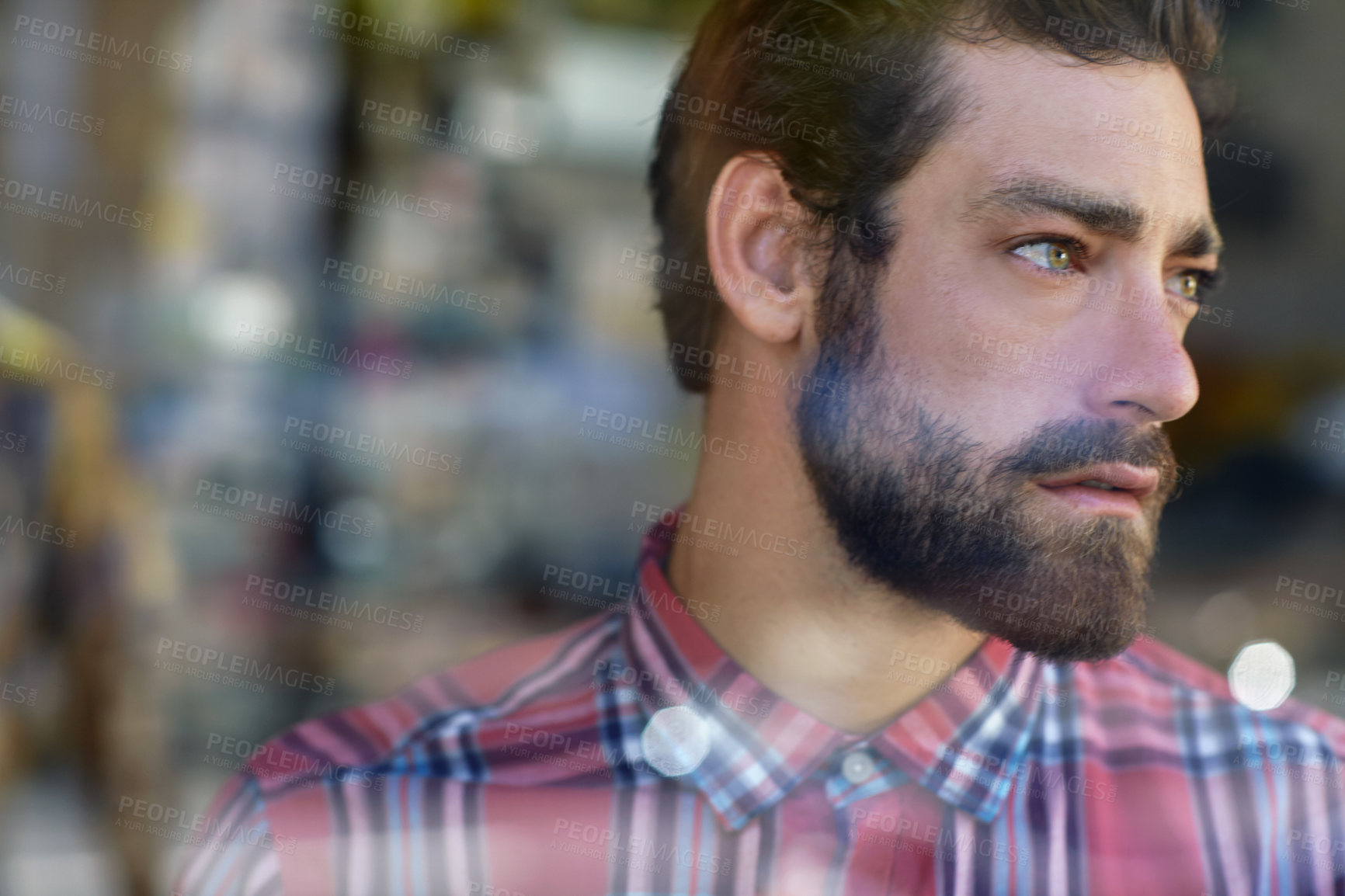 Buy stock photo Cropped shot of a young man in a cafe