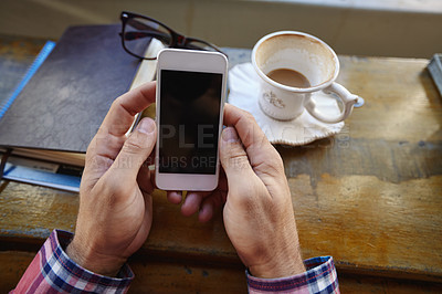 Buy stock photo Cropped shot of a man using a cellphone at a cafe