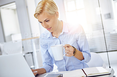 Buy stock photo Cropped shot of a young businesswoman using a laptop at her desk