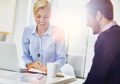 Buy stock photo Cropped shot of two young businesspeople in the office