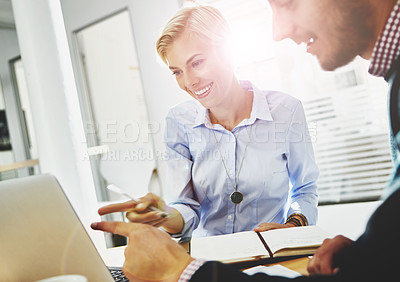 Buy stock photo Cropped shot of two young businesspeople in the office